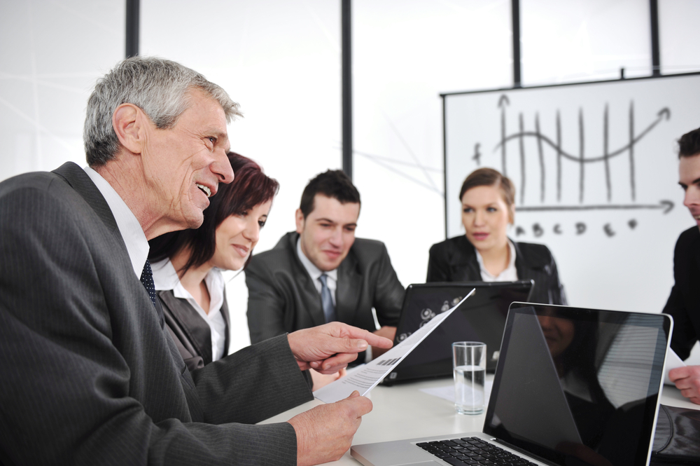 CEO reading report at business meeting CEO reading report at business meeting